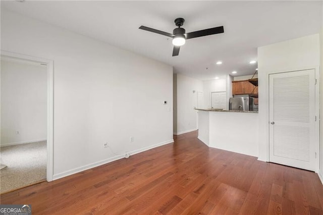 821 Ralph Mcgill Blvd NE Unit 2113, Atlanta, GA 30306 - unfurnished living room featuring ceiling fan, recessed lighting, baseboards, and wood finished floors