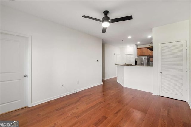 821 Ralph Mcgill Blvd NE Unit 2113, Atlanta, GA 30306 - unfurnished living room featuring baseboards, recessed lighting, ceiling fan, and wood finished floors