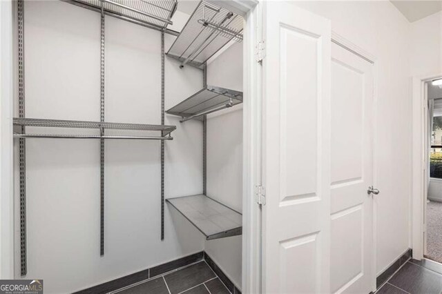 821 Ralph Mcgill Blvd NE Unit 2113, Atlanta, GA 30306 - walk in closet with dark tile patterned floors