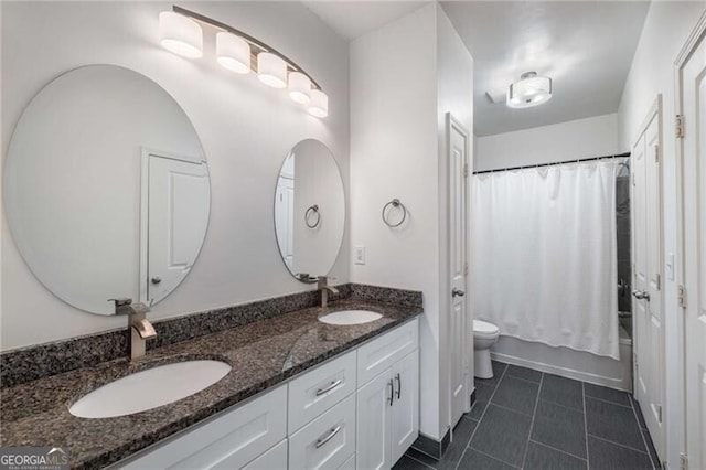821 Ralph Mcgill Blvd NE Unit 2113, Atlanta, GA 30306 - bathroom featuring toilet, tile patterned flooring, double vanity, and a sink