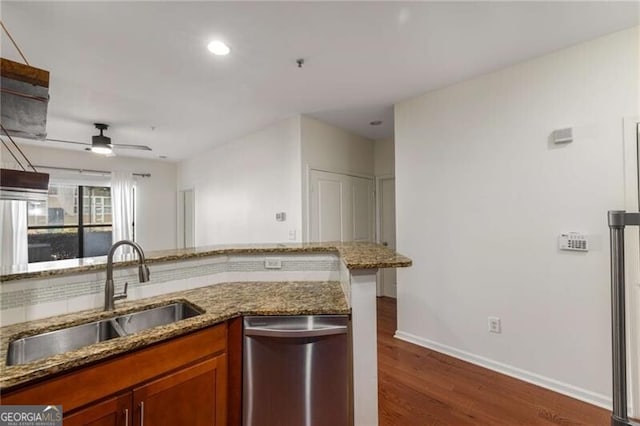 821 Ralph Mcgill Blvd NE Unit 2113, Atlanta, GA 30306 - kitchen featuring stone countertops, stainless steel dishwasher, ceiling fan, a sink, and dark wood-type flooring