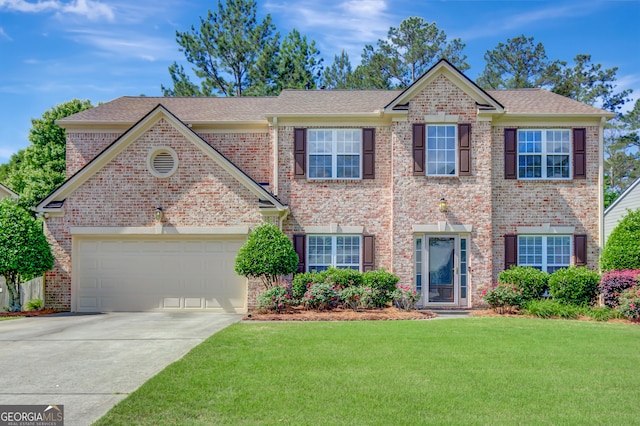 view of front of home featuring a front lawn, concrete driveway, an attached garage, and brick siding