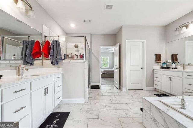 6375 Haystack Ct, Cumming, GA 30040 - full bath featuring a stall shower, baseboards, marble finish floor, visible vents, and a sink