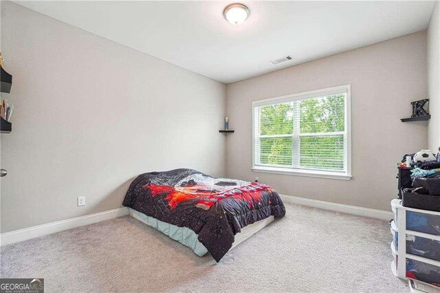 6375 Haystack Ct, Cumming, GA 30040 - carpeted bedroom featuring baseboards