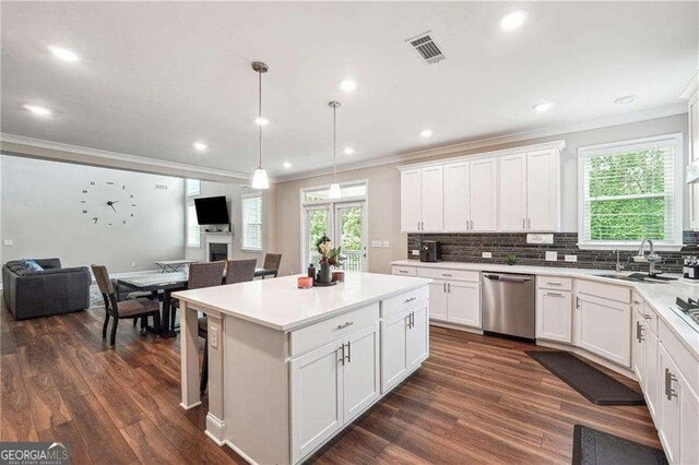 6375 Haystack Ct, Cumming, GA 30040 - kitchen with a sink, open floor plan, crown molding, stainless steel dishwasher, and visible vents