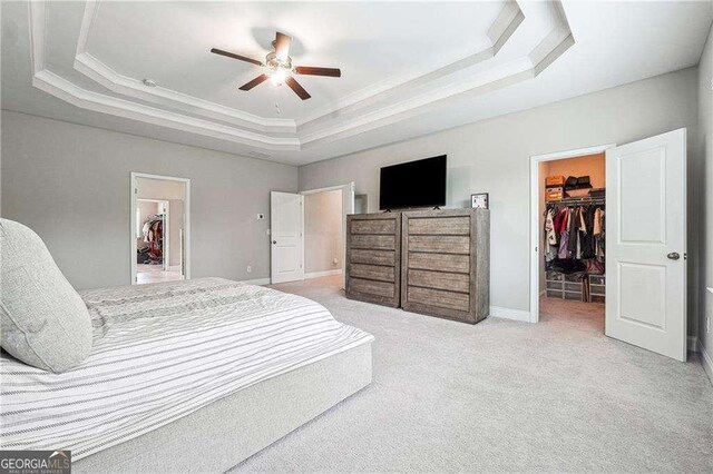 6375 Haystack Ct, Cumming, GA 30040 - bedroom featuring a closet, a raised ceiling, a spacious closet, and crown molding