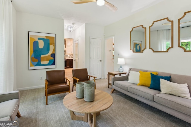 living room featuring carpet flooring and ceiling fan