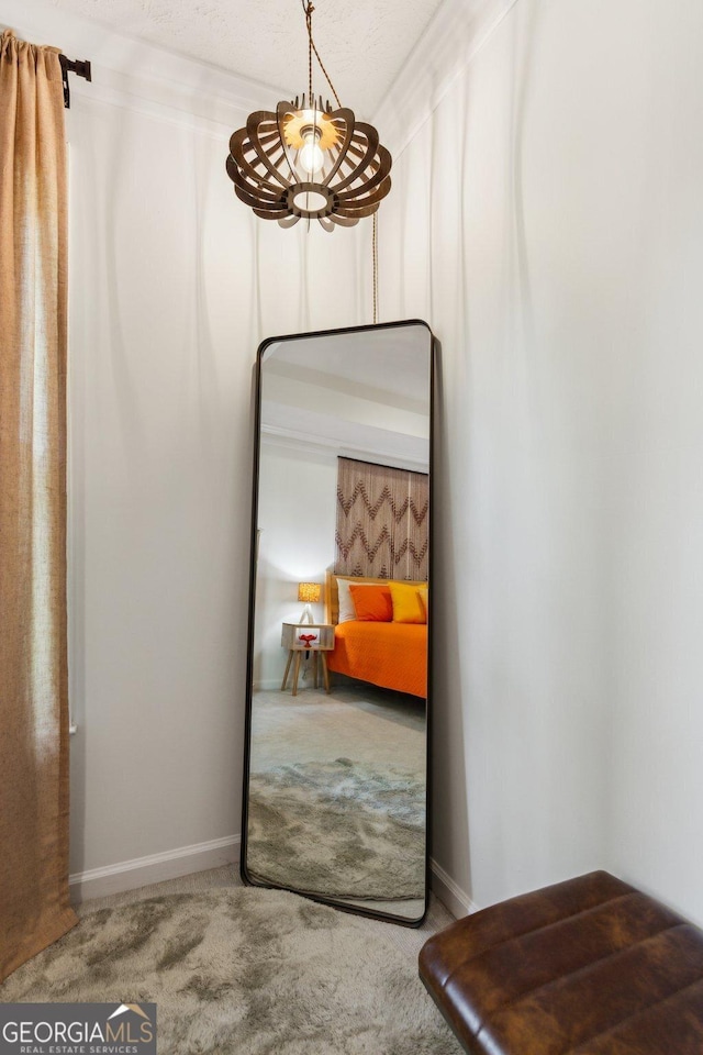 interior space with carpet flooring and baseboards