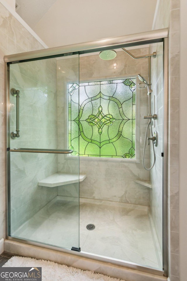 bathroom with a stall shower