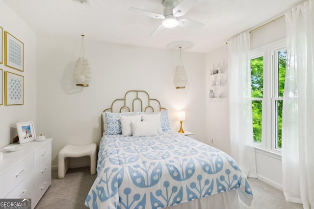 carpeted bedroom featuring ceiling fan