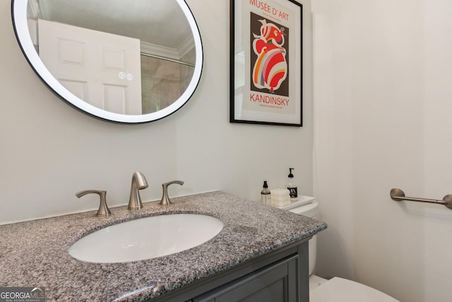 bathroom with toilet and vanity