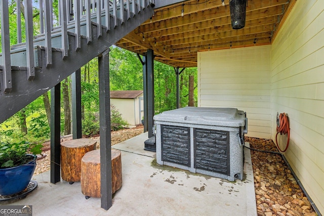 view of patio / terrace with an outbuilding and a storage unit