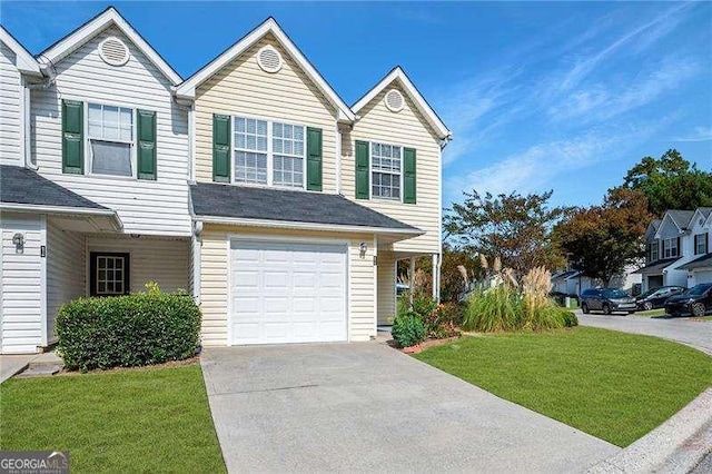 6918 Gallant Cir SE Unit 22, Mableton, GA 30126 - view of front of home with concrete driveway, a garage, and a front yard