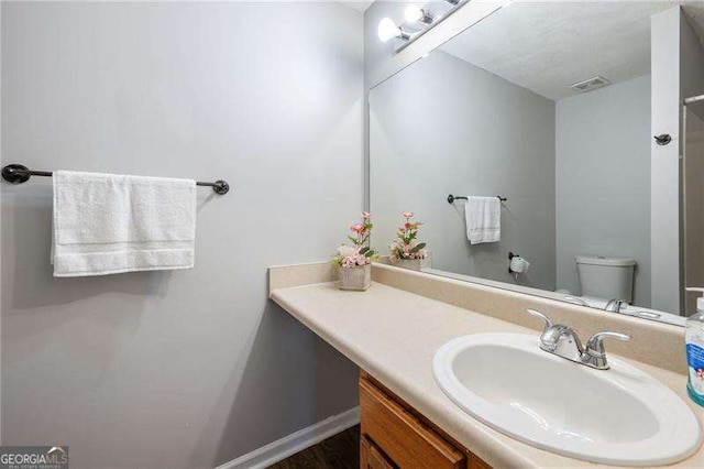 6918 Gallant Cir SE Unit 22, Mableton, GA 30126 - bathroom featuring toilet, visible vents, and vanity