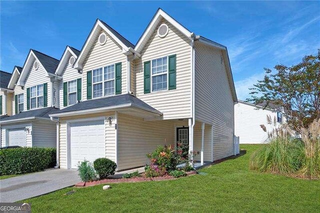 6918 Gallant Cir SE Unit 22, Mableton, GA 30126 - view of property featuring an attached garage, a front lawn, and driveway