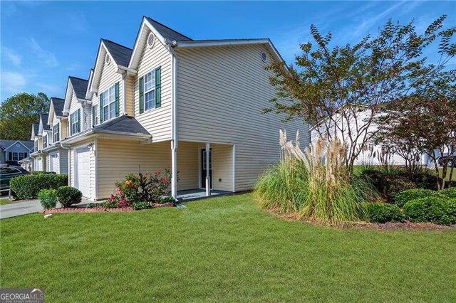 6918 Gallant Cir SE Unit 22, Mableton, GA 30126 - view of home's exterior with a lawn and an attached garage