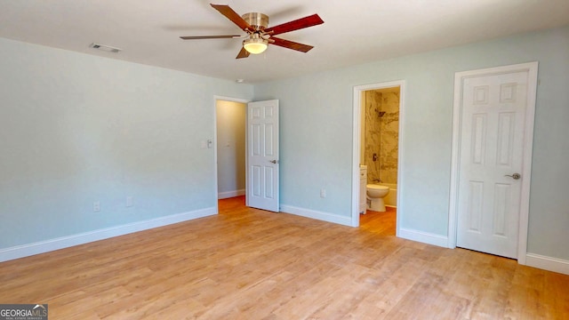 165 Cherokee Cir, Hinesville, GA 31313 - unfurnished bedroom with light wood-style flooring, baseboards, ensuite bathroom, and a ceiling fan
