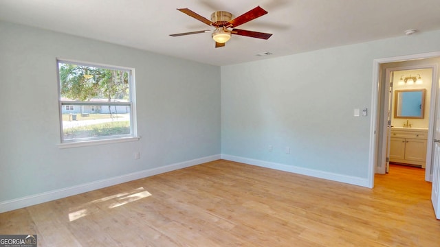 165 Cherokee Cir, Hinesville, GA 31313 - unfurnished room featuring light wood-type flooring, a ceiling fan, baseboards, and a smoke detector