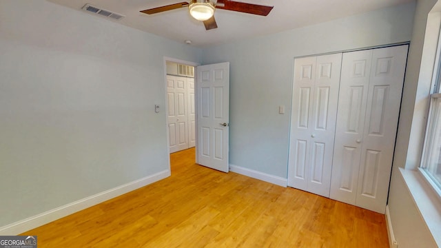165 Cherokee Cir, Hinesville, GA 31313 - unfurnished bedroom featuring light wood-style floors, baseboards, a closet, and a ceiling fan