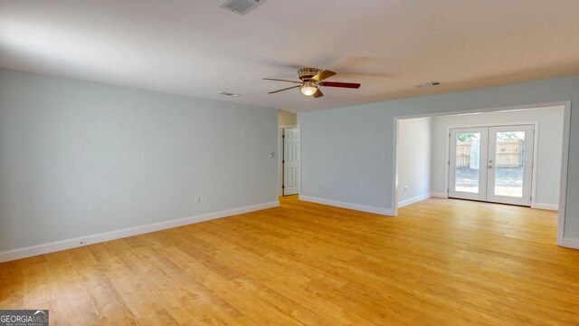 165 Cherokee Cir, Hinesville, GA 31313 - unfurnished room with french doors, baseboards, light wood-style flooring, and ceiling fan