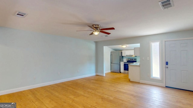 165 Cherokee Cir, Hinesville, GA 31313 - entrance foyer with a ceiling fan, light wood-style floors, and baseboards