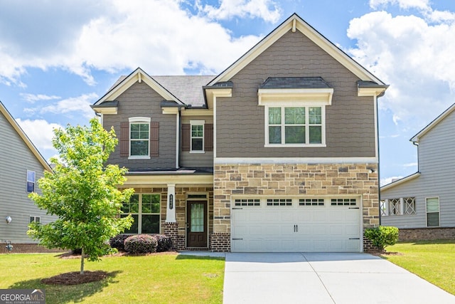 craftsman inspired home with concrete driveway, a front lawn, a garage, and stone siding