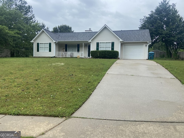 248 Fern Ct, Hampton, GA 30228 - ranch-style house with covered porch, concrete driveway, a garage, and a front lawn