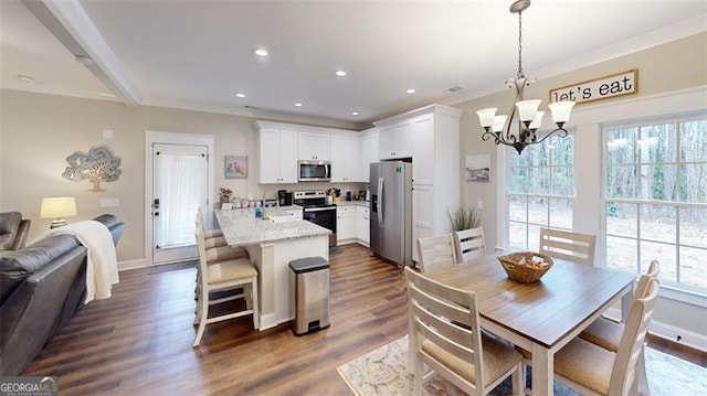40 Luther Knight Rd, Cartersville, GA 30121 - dining space featuring recessed lighting, baseboards, a chandelier, ornamental molding, and dark wood-style floors