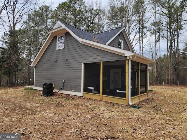 40 Luther Knight Rd, Cartersville, GA 30121 - rear view of house featuring a sunroom, central AC unit, and roof with shingles