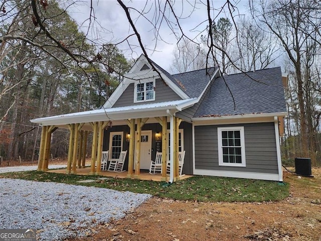 40 Luther Knight Rd, Cartersville, GA 30121 - view of front of home featuring covered porch, a shingled roof, and central AC