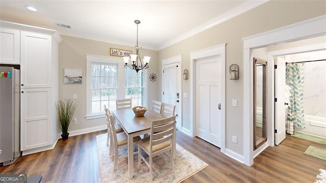 40 Luther Knight Rd, Cartersville, GA 30121 - dining space with a chandelier, visible vents, ornamental molding, and dark wood-style floors