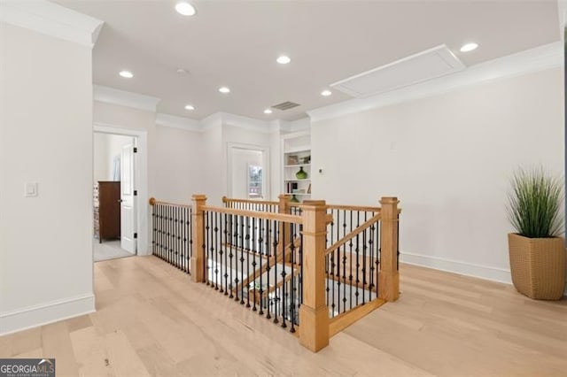 5247 Flannery Chase SW, Powder Springs, GA 30127 - corridor with an upstairs landing, attic access, crown molding, wood finished floors, and baseboards
