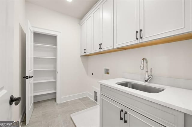 5247 Flannery Chase SW, Powder Springs, GA 30127 - washroom featuring washer hookup, cabinet space, electric dryer hookup, and baseboards
