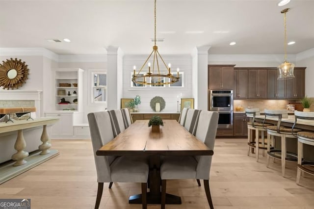 5247 Flannery Chase SW, Powder Springs, GA 30127 - dining room featuring a chandelier, ornamental molding, light wood-style floors, recessed lighting, and built in shelves