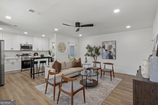 3634 Oakleaf Pass, Fairburn, GA 30213 - living room featuring a ceiling fan, recessed lighting, light wood-style flooring, and visible vents