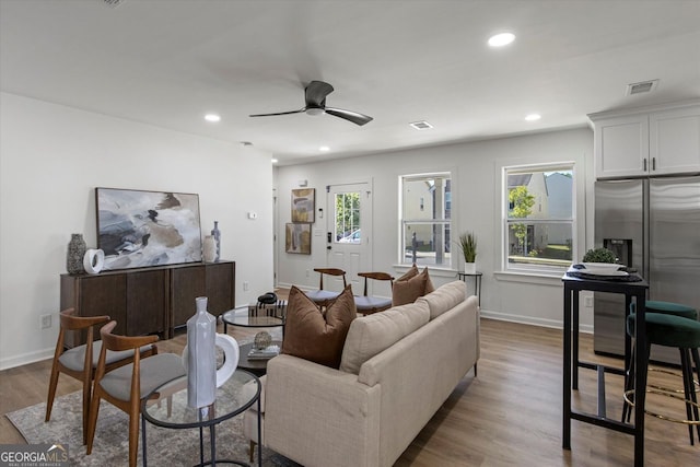 3634 Oakleaf Pass, Fairburn, GA 30213 - living area with ceiling fan, recessed lighting, visible vents, and wood finished floors