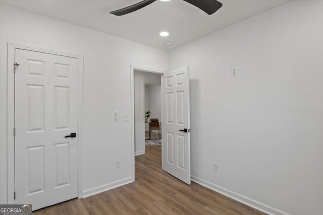 3634 Oakleaf Pass, Fairburn, GA 30213 - unfurnished bedroom featuring recessed lighting, baseboards, a ceiling fan, and wood finished floors