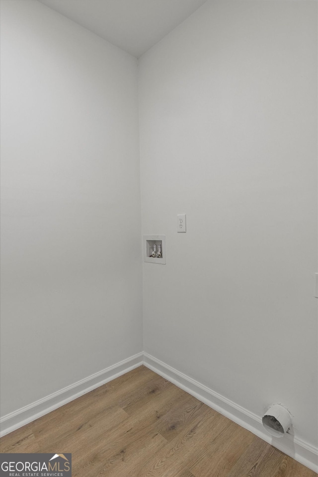 3634 Oakleaf Pass, Fairburn, GA 30213 - laundry room with light wood finished floors, laundry area, baseboards, and washer hookup