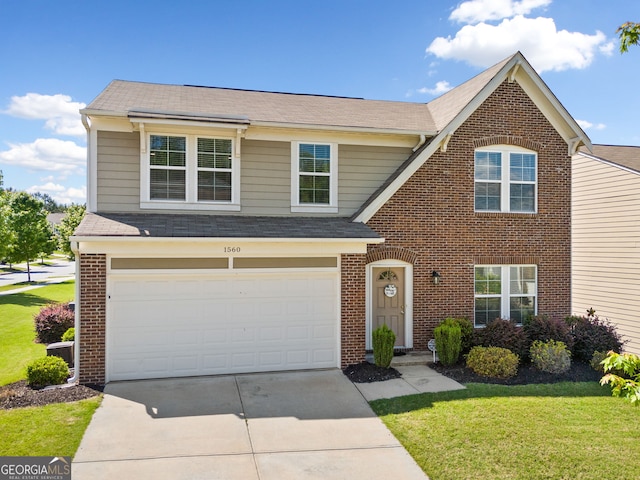 traditional-style house with brick siding, concrete driveway, a front yard, an attached garage, and a shingled roof