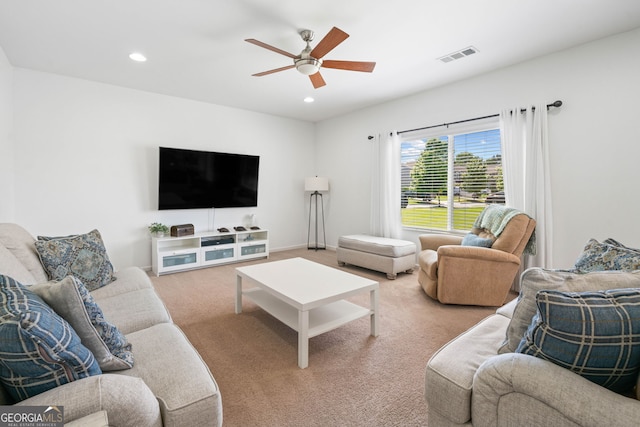 living area with a ceiling fan, carpet, and recessed lighting