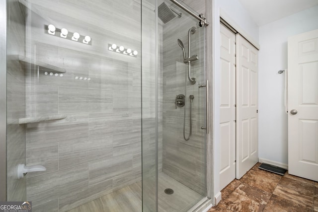bathroom featuring a shower stall