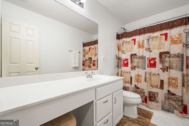 full bath with vanity, toilet, and curtained shower