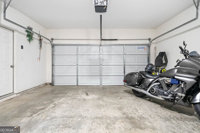 garage featuring a garage door opener
