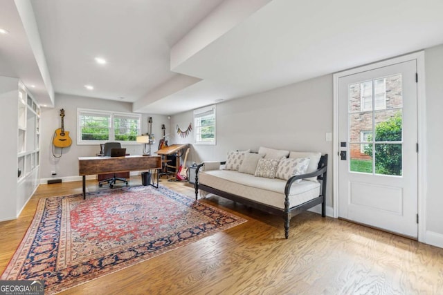 office space with wood finished floors, recessed lighting, and baseboards