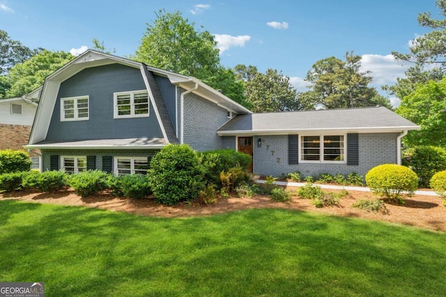 3772 Evans Rd, Atlanta, GA 30340 - split level home featuring a front yard and brick siding
