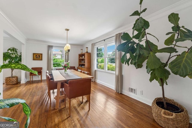 3772 Evans Rd, Atlanta, GA 30340 - dining space with plenty of natural light, baseboards, wood finished floors, and crown molding