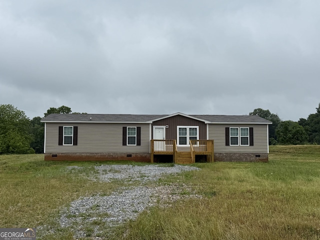 236 Dewaters Rd, Commerce, GA 30529 - manufactured / mobile home with crawl space, a deck, and a front lawn
