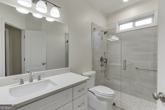 full bathroom featuring crown molding, toilet, a stall shower, and vanity