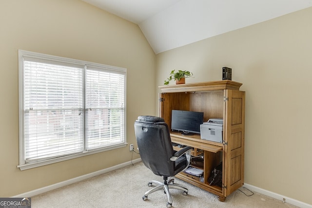 home office with carpet floors, lofted ceiling, and baseboards