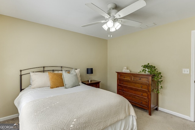 bedroom with carpet, visible vents, baseboards, and a ceiling fan